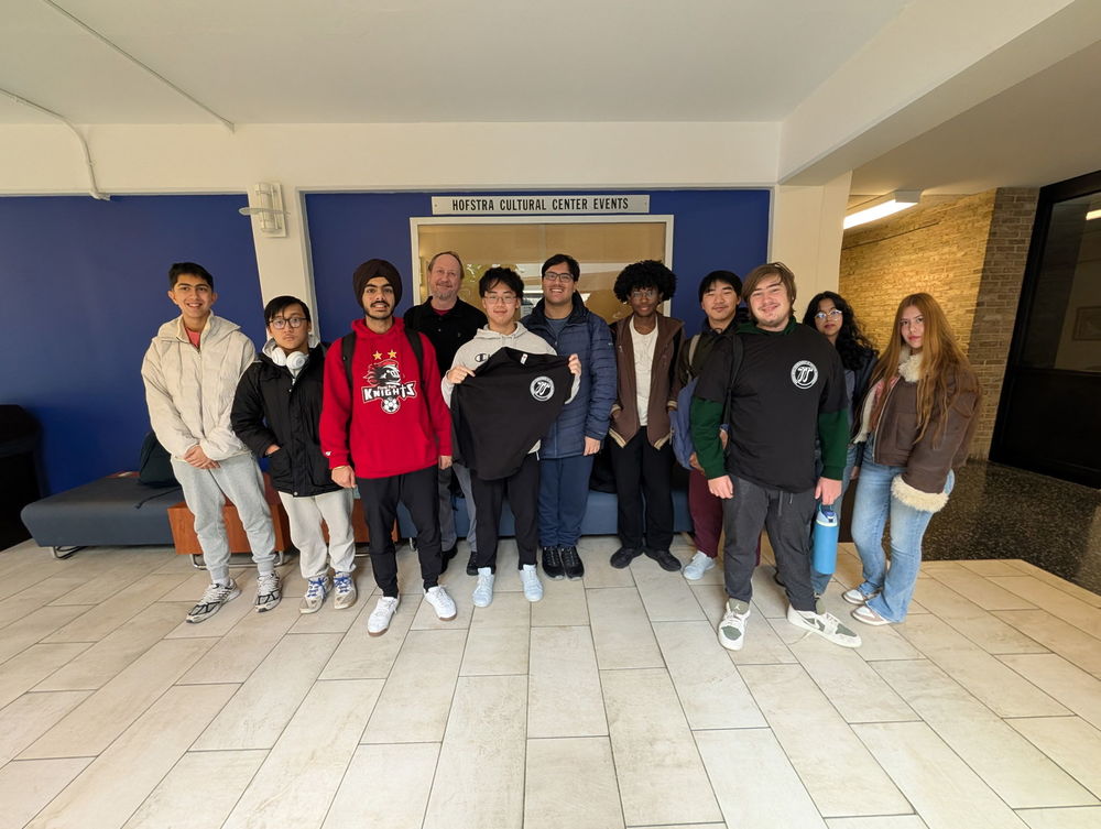 Students smiling with teacher.