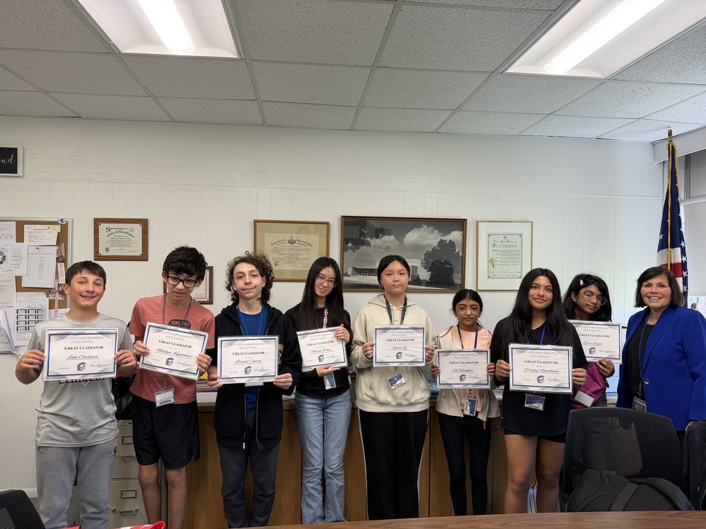 Students holding awards.