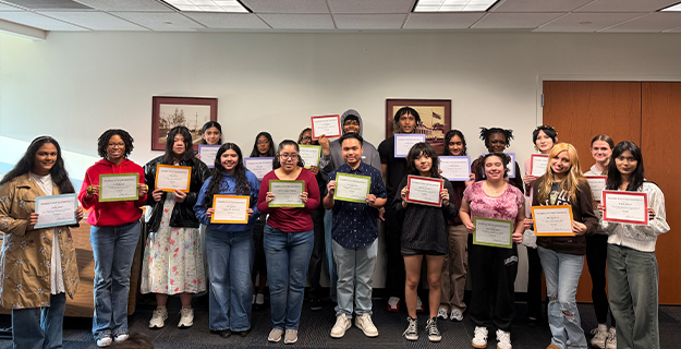 Students holding awards.