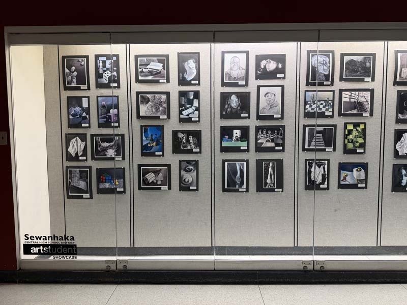 Student artwork displayed in showcase.
