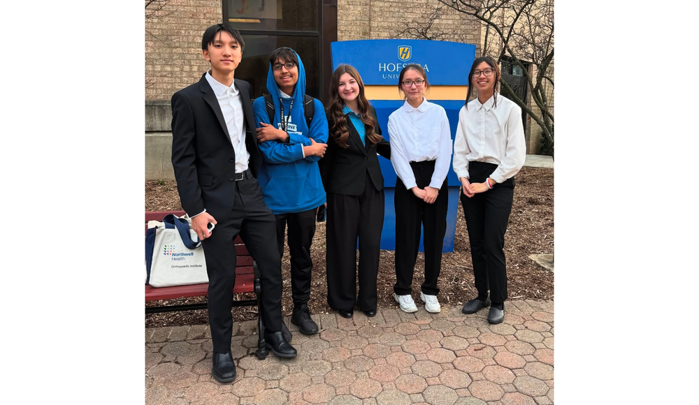5 Students standing in front of hoftstra