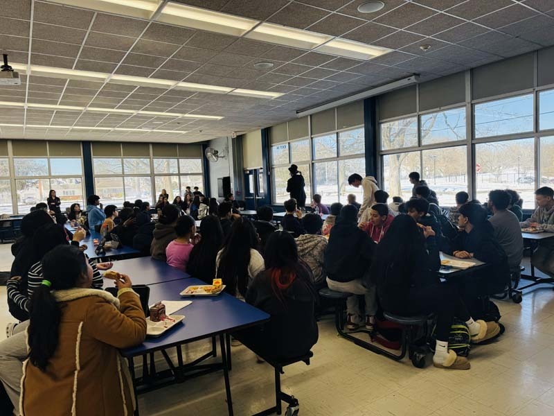 Students on computers in classroom.