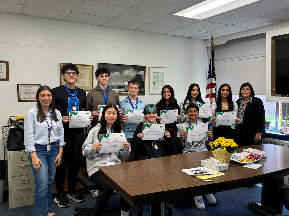 Students holding certificates.