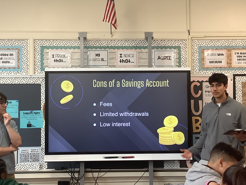 Student giving presentation on Savings Accounts.