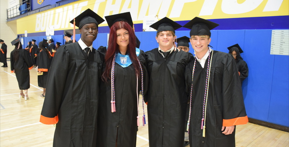 graduates in black caps and gowns