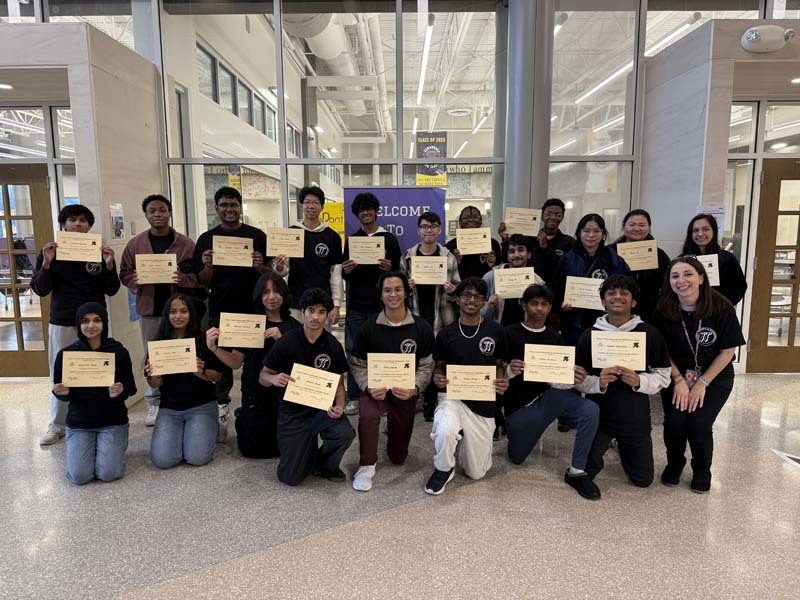 Students holding certificates