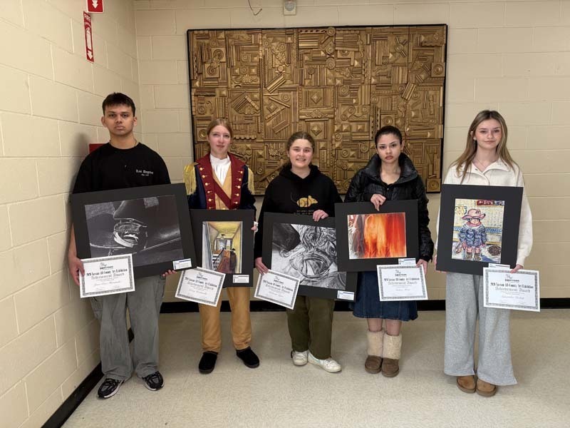 Students holding their projects.