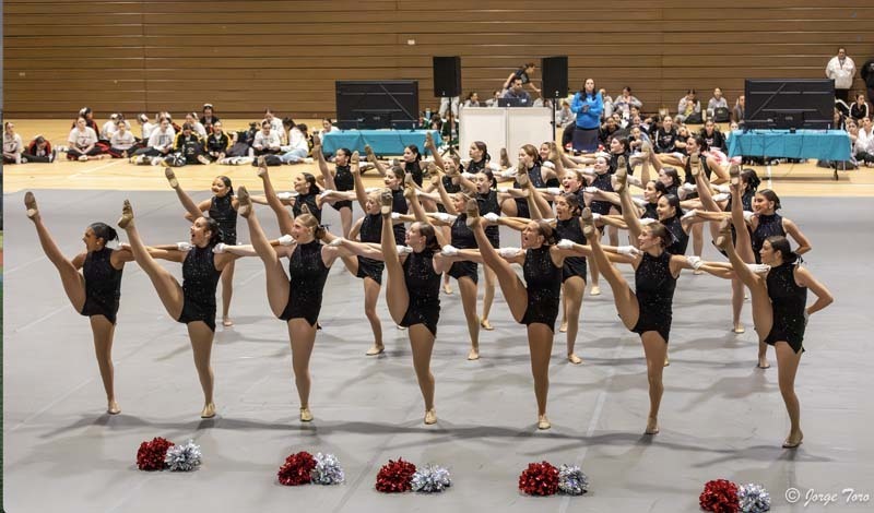 Florettes dancing in gymnasium.