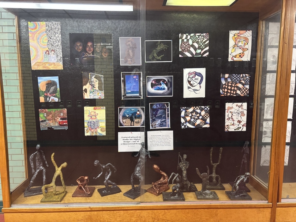 Student artwork in wooden display.