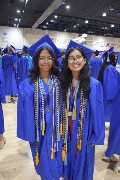 Graduating seniors smiling together.
