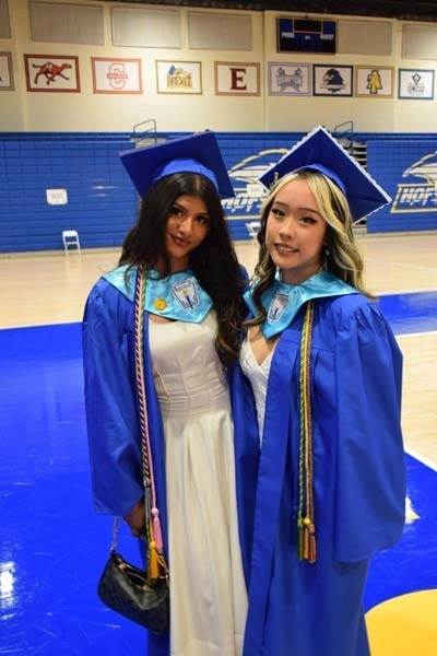 Graduating seniors smiling together.
