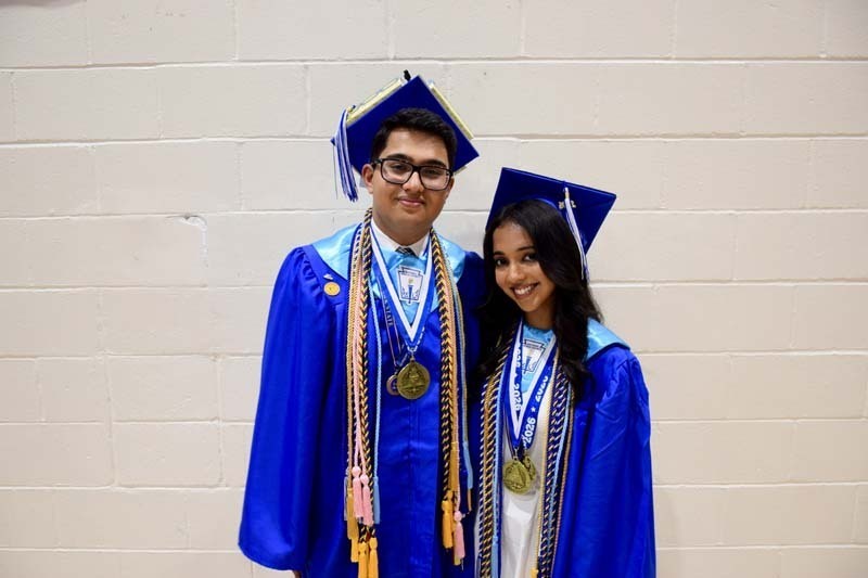 Graduating seniors smiling together.