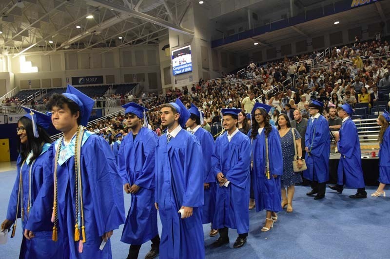 Graduating seniors smiling together.