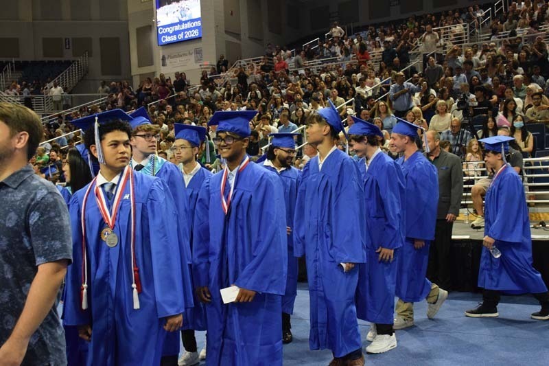Graduating seniors smiling together.