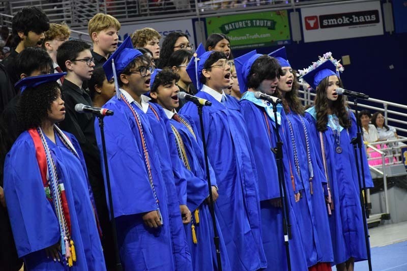 Graduating seniors smiling together.