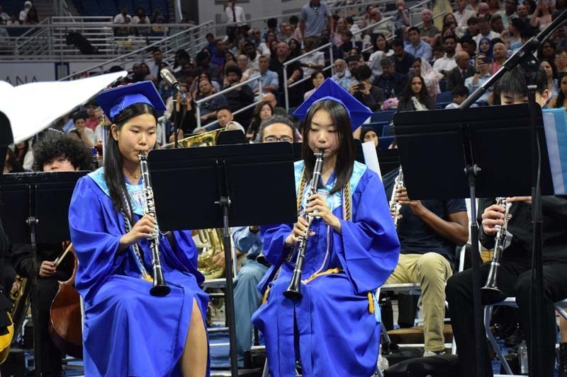 Graduating seniors smiling together.