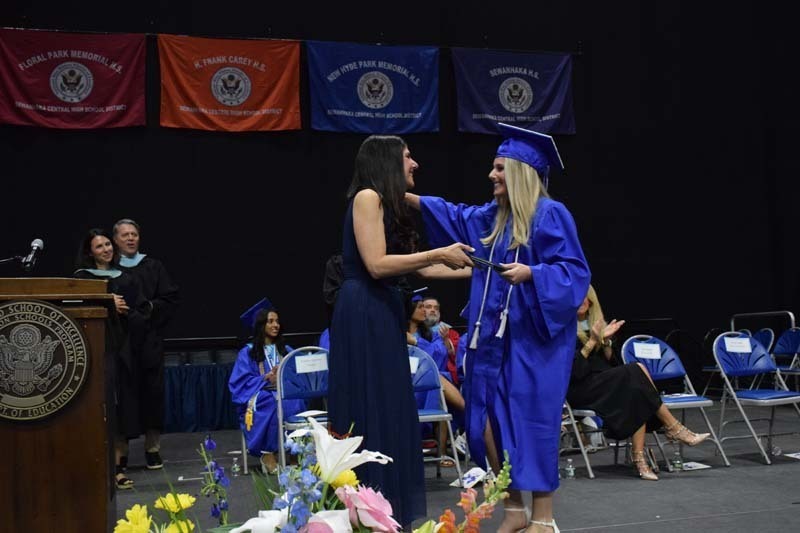 Graduating seniors smiling together.