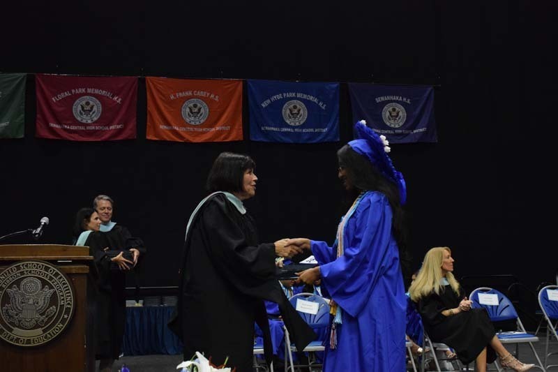 Graduating seniors smiling together.