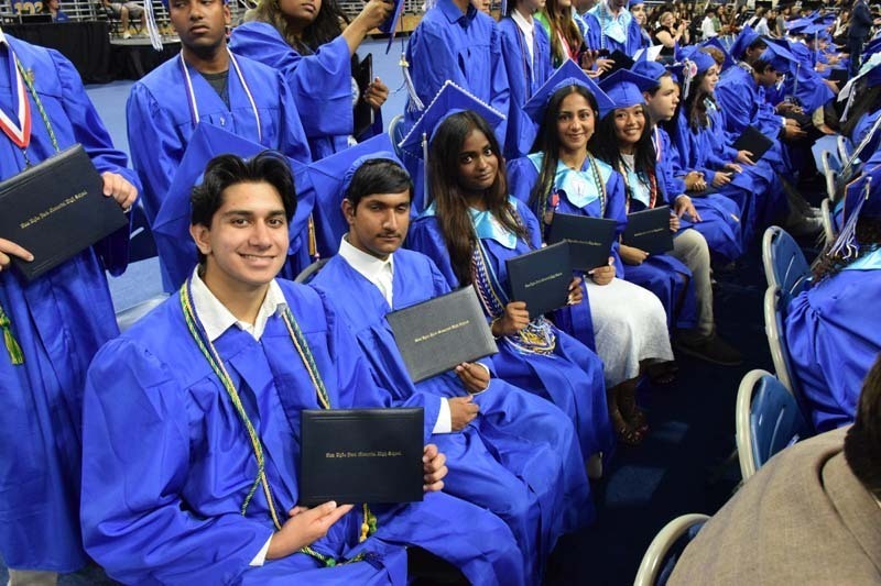 Graduating seniors smiling together.