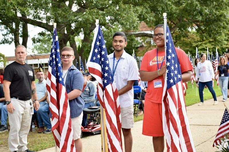 Men holding American flags.