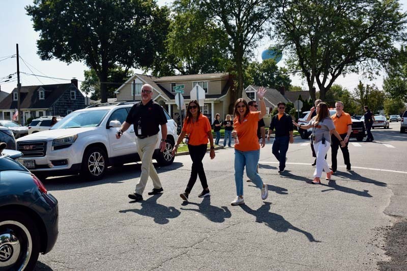 Administration walks in the homecoming parade