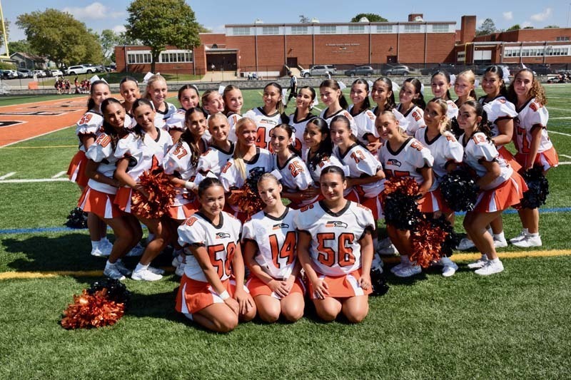 Variety cheerleaders pose for a photo before the homecoming game
