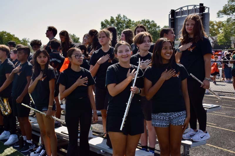 Marching band students during the Pledge of Allegiance