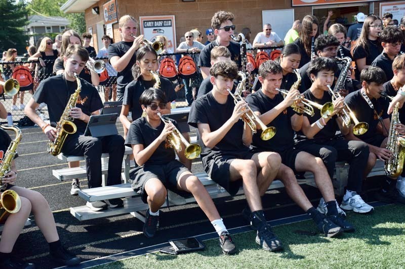 Marching band students play during the game.