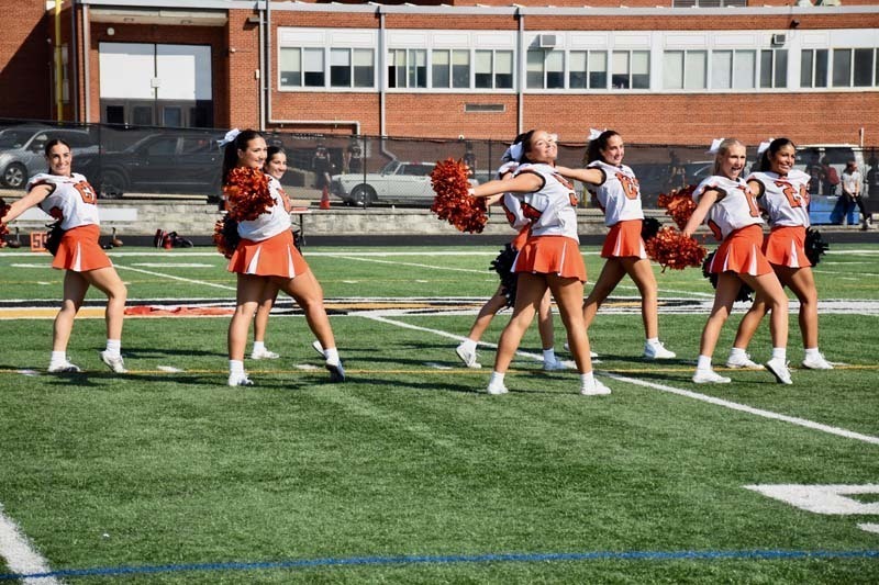 Varsity cheerleaders perform during halftime