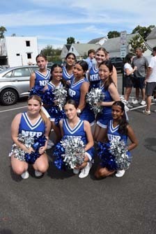 Junior varsity cheerleaders pose for a photo before the parade.