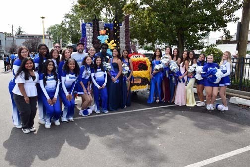 Seniors are pictured with the Class of 2026 homecoming float.