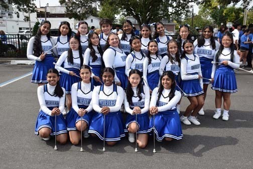 Twirlers pose for a photo before the parade.