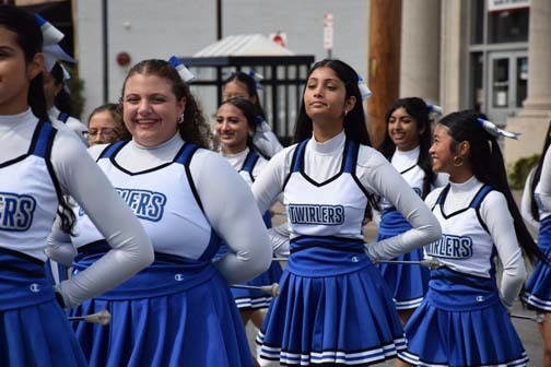 Twirlers walk in the homecoming parade.