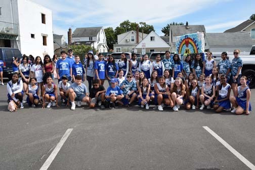 Seventh graders are pictured with their homecoming float.