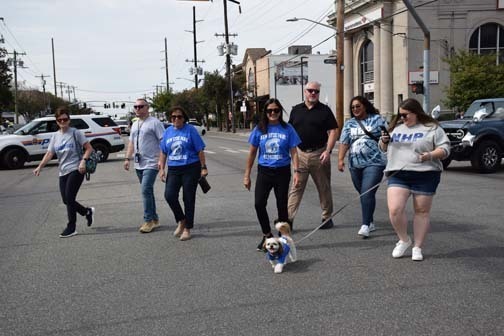 Administrators walk in the homecoming parade.