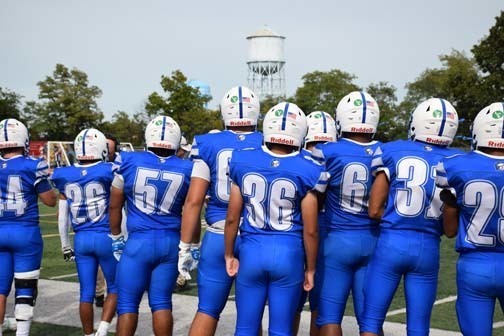 Gladiators football team is pictured on the field.