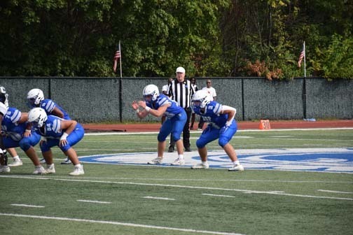 Gladiators football team is pictured on the field.