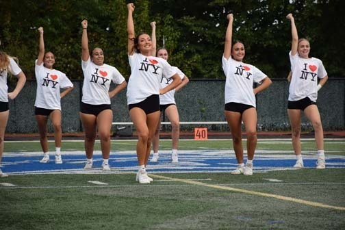 Varsity cheerleaders perform during halftime show.