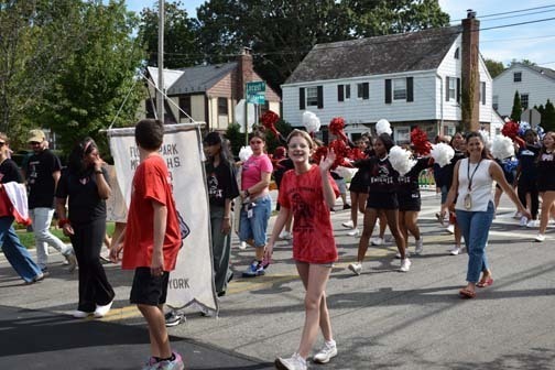 Eagle Scouts and Boy Scouts walk in the parade.
