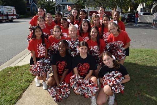 Cheerleaders pose for a photo before the homecoming parade.