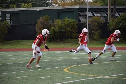The Florettes pose for a photo before the start of the homecoming game.