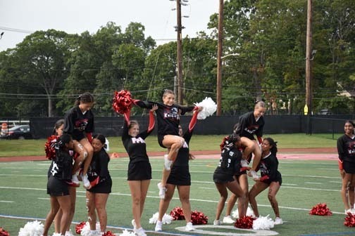 The varsity cheerleaders perform during halftime.