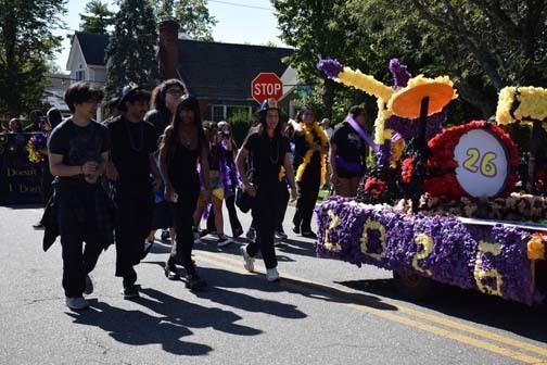Students walk in the parade.