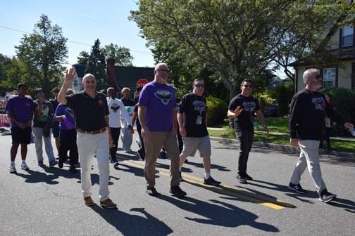 Administrators walk in the parade.