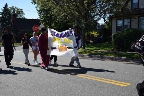 Students walk in the parade.