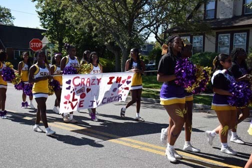 Students walk in the parade.