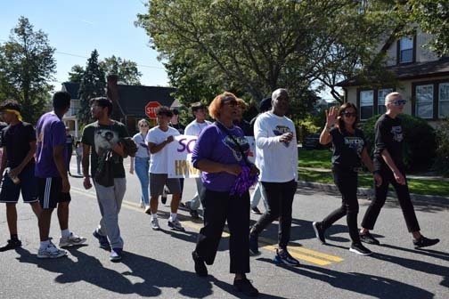 Administrators walk in the parade.