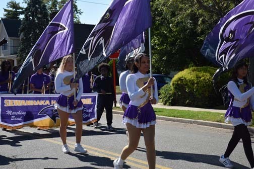 Marching band students perform and walk in the parade.