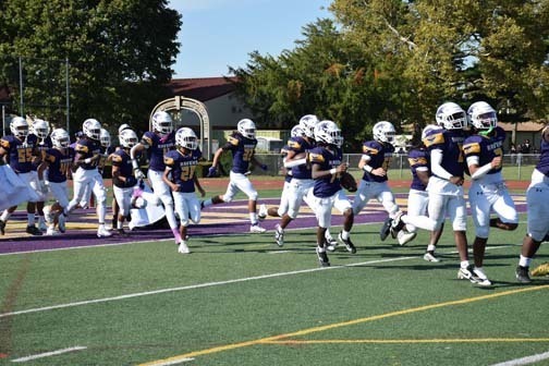 The Ravens enter the field to begin the homecoming game.
