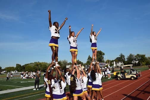 Cheerleaders and crowd are pictured during the game.